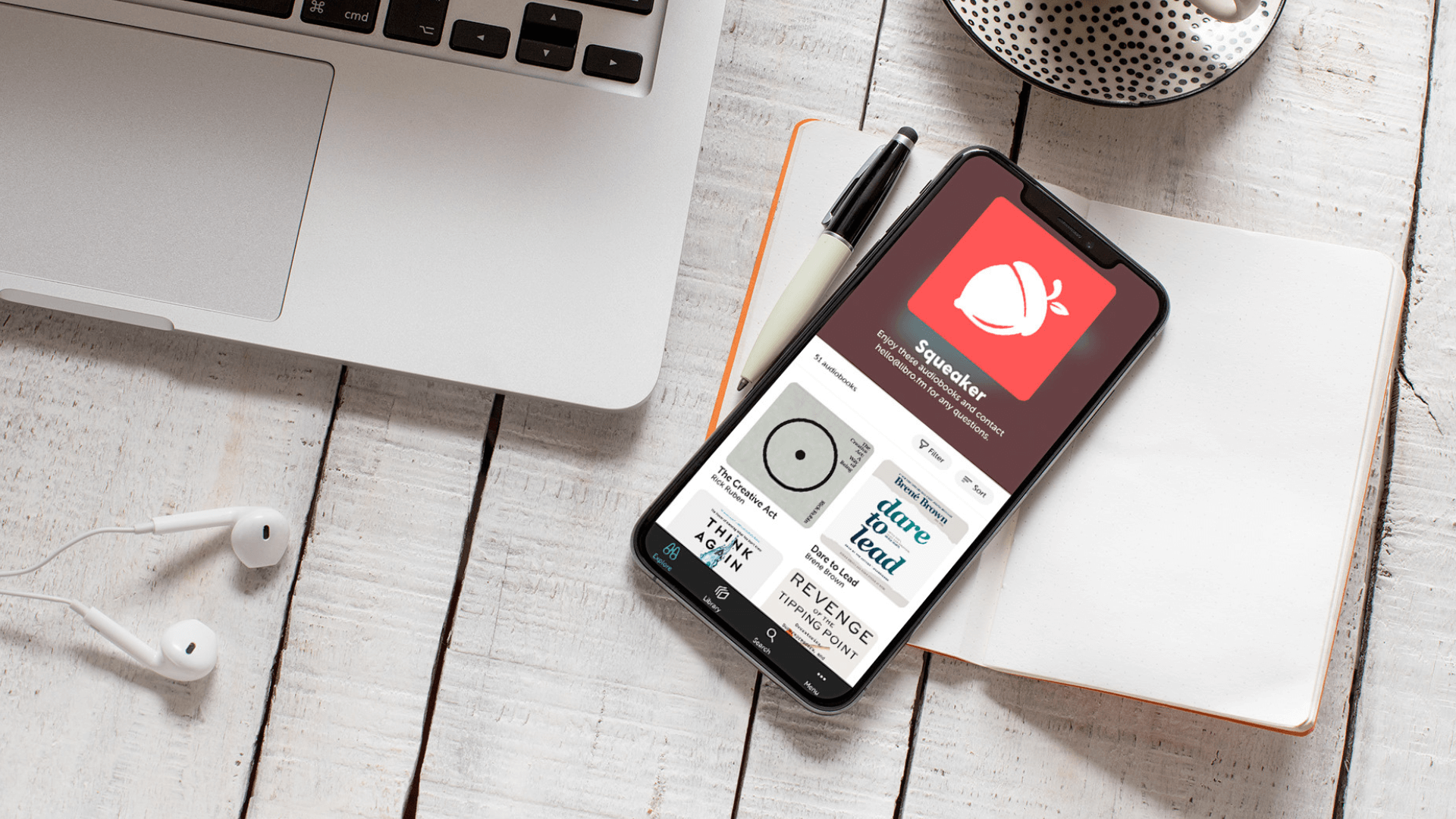 Libro.fm app next to a laptop